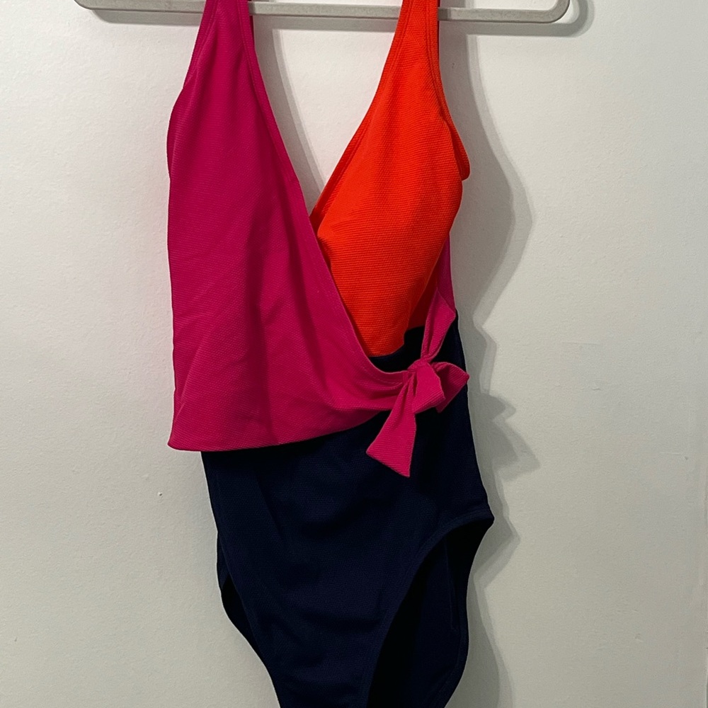 Tommy Bahama side tie one piece. Fits true to size.